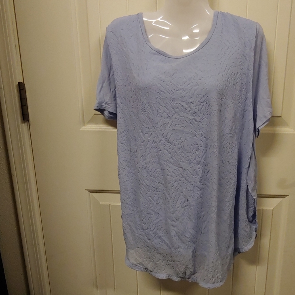 Light blue or lilac colored blouse